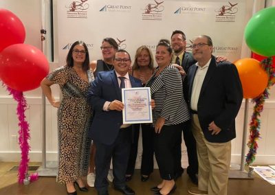 Beverly Homecoming committee members holding their recognition certificate at the Greater Beverly Chamber of Commerce event
